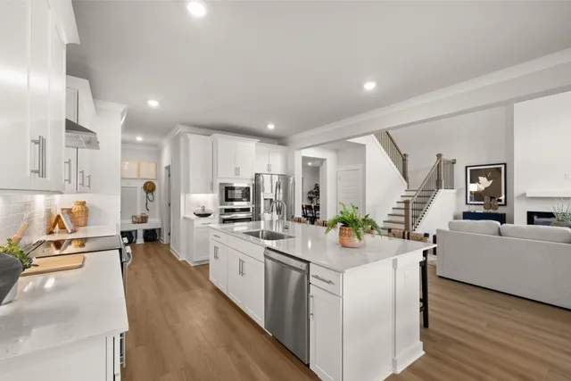 a spacious bathroom with a double vanity sink and a mirror