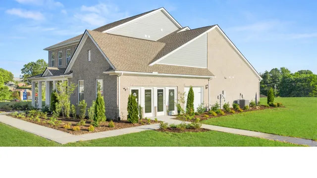a view of a livingroom with furniture and windows