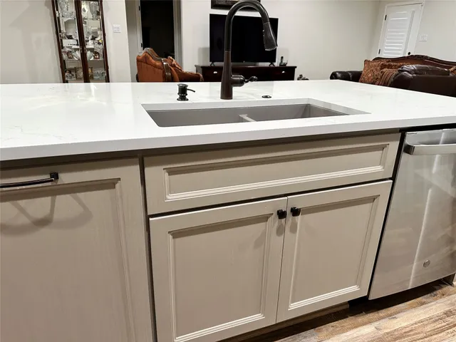a bathroom with a sink and mirror