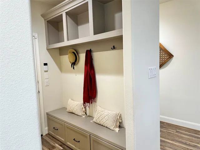 a view of walk in closet with clothes