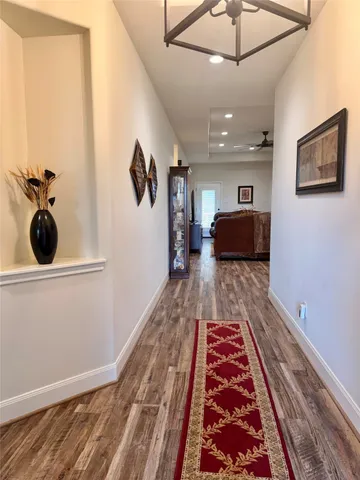 a living room with a couch and a rug