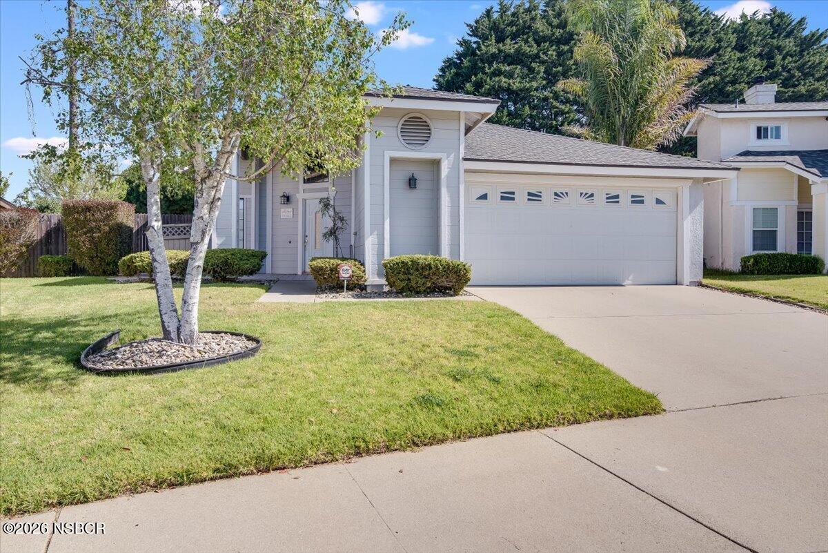 933 Bellflower Lane Lompoc, CA 93436 - Photo 1 of 17 a front view of a house with a yard
