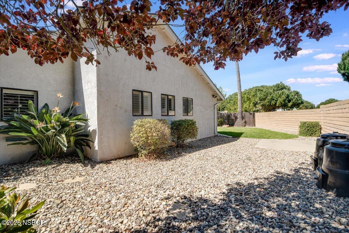 933 Bellflower Lane Lompoc, CA 93436 - Photo 17 of 17 a house with a tree in front of it