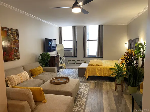 a living room with furniture and a large window