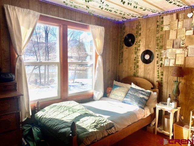 485 Florida Road, Unit B10 Durango, CO 81301 - Photo 12 of 19 a bedroom with a bed and a window
