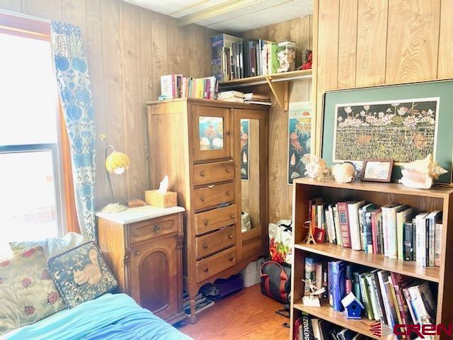485 Florida Road, Unit B10 Durango, CO 81301 - Photo 15 of 19 a bedroom with a bed and a book shelf