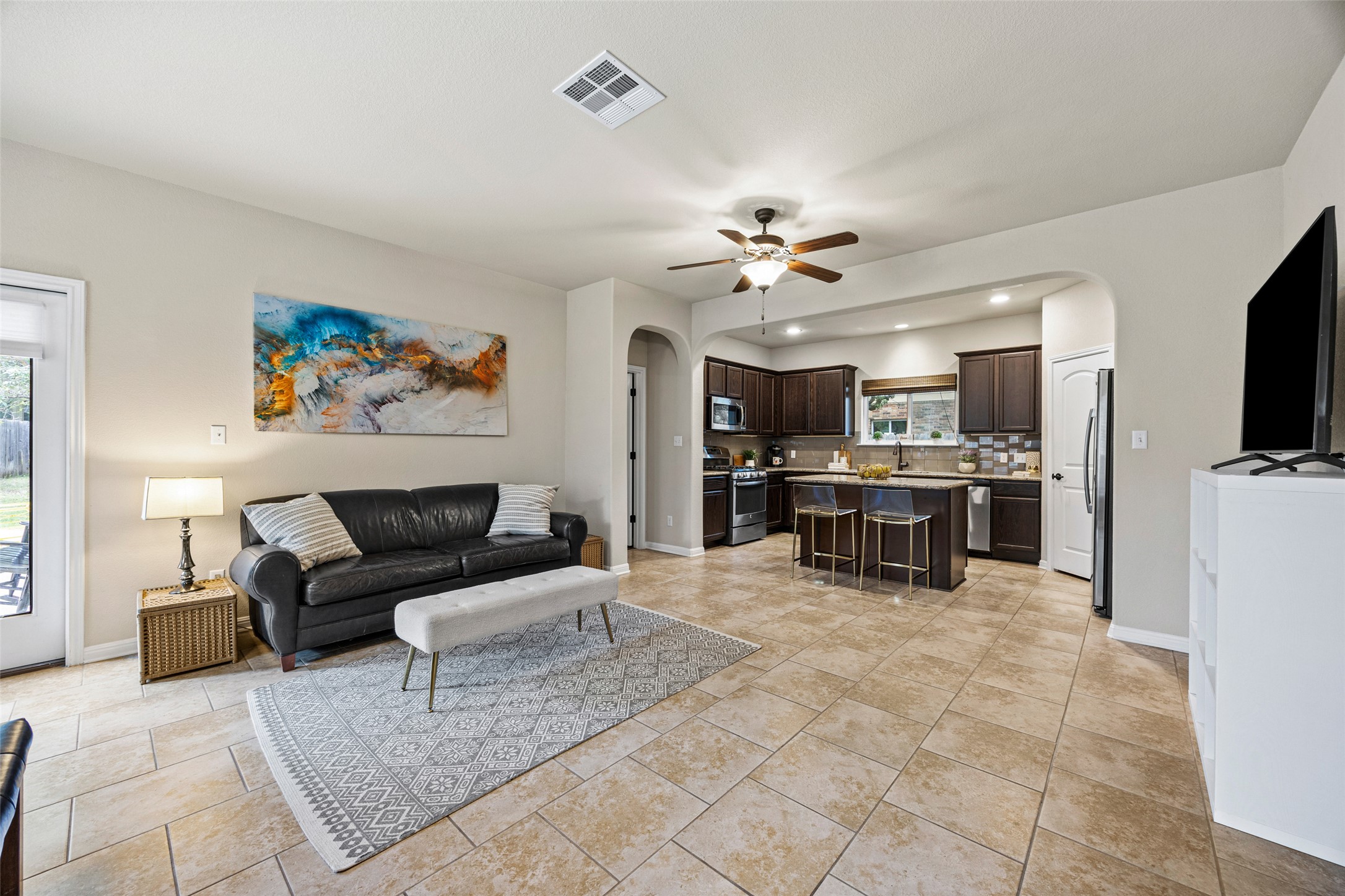 3451 Mayfield Ranch Boulevard, Unit 201 Round Rock, TX 78681 - Photo 3 of 29 a living room with furniture and kitchen view