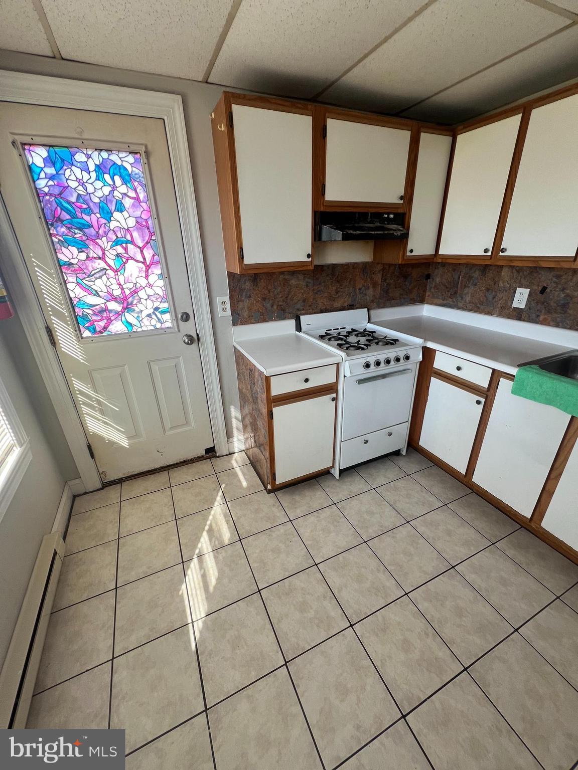 107 North York Street, Unit 3 Pottstown, PA 19464 - Photo 7 of 13 a kitchen with stainless steel appliances a stove a sink and a microwave