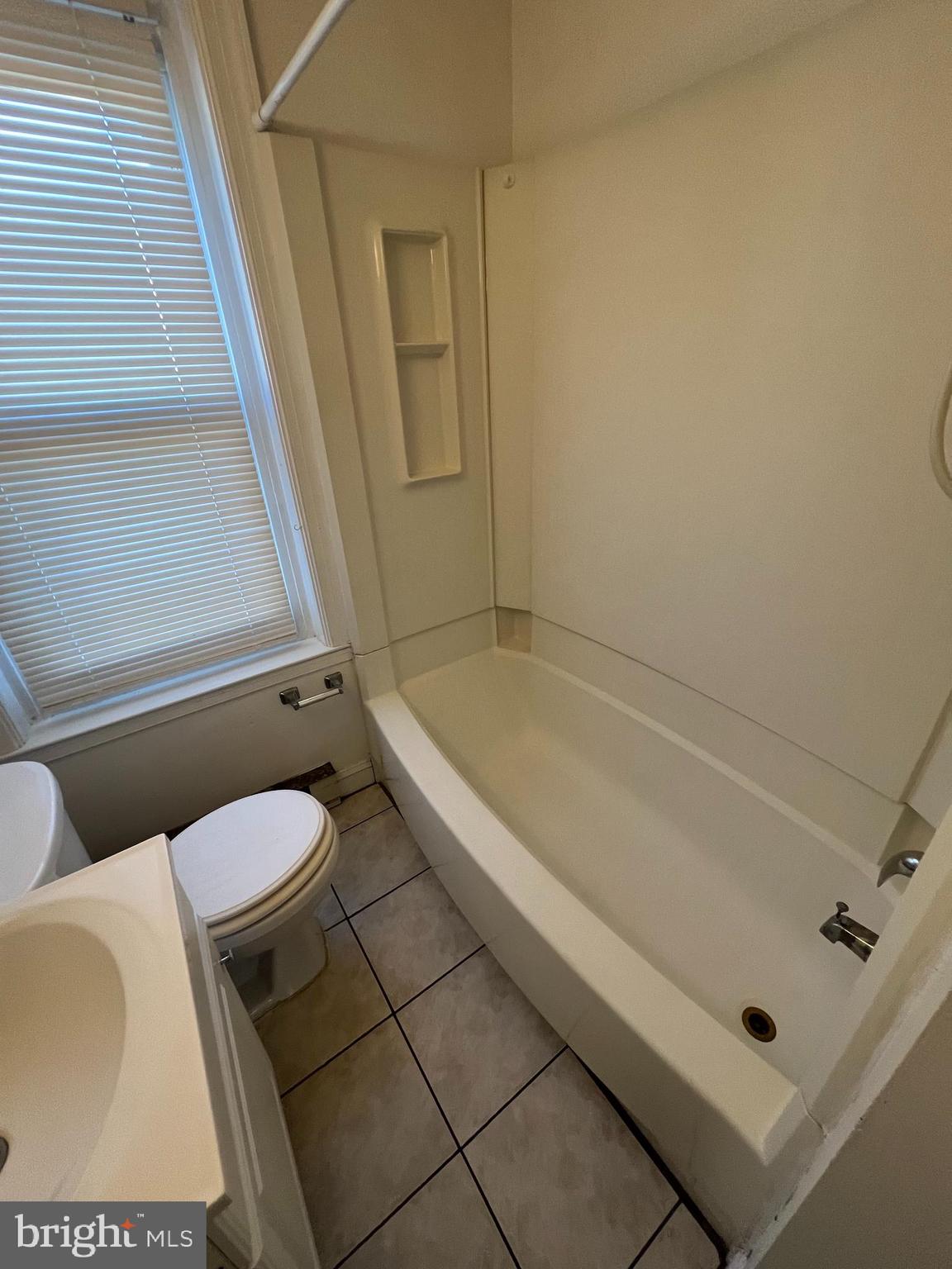 107 North York Street, Unit 3 Pottstown, PA 19464 - Photo 8 of 13 a bathroom with a toilet and a shower