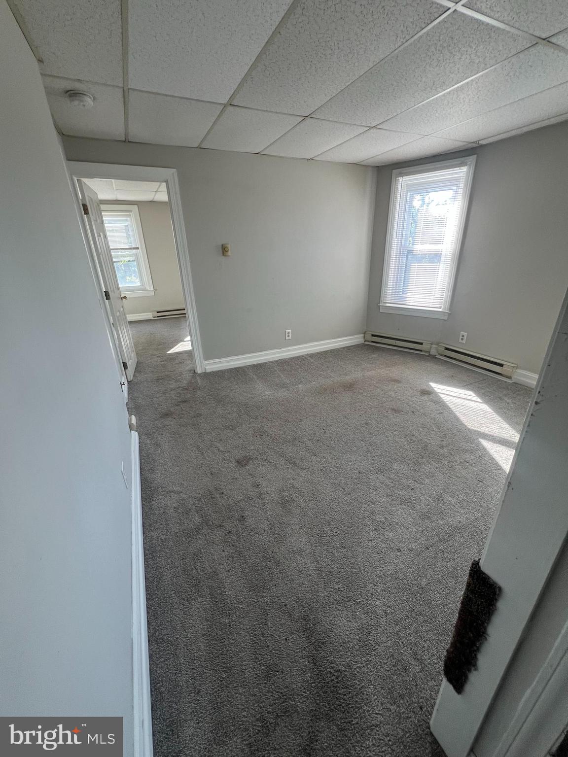 107 North York Street, Unit 3 Pottstown, PA 19464 - Photo 10 of 13 an empty room with windows