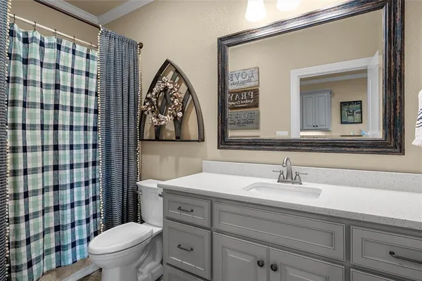 a living room with furniture a rug and a window