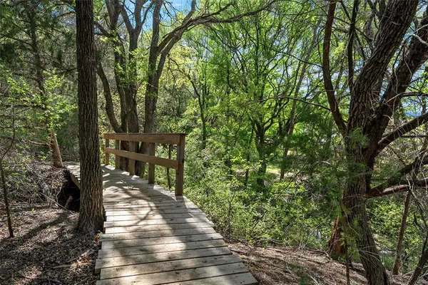 a view of a lake with couches and city view