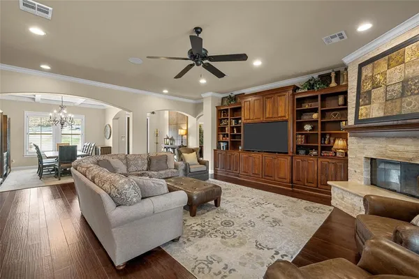 a living room with furniture and a fireplace