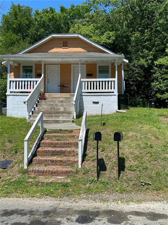 145 Lore Street Southwest Concord, NC 28025 - Photo 1 of 9 a front view of a house with a yard