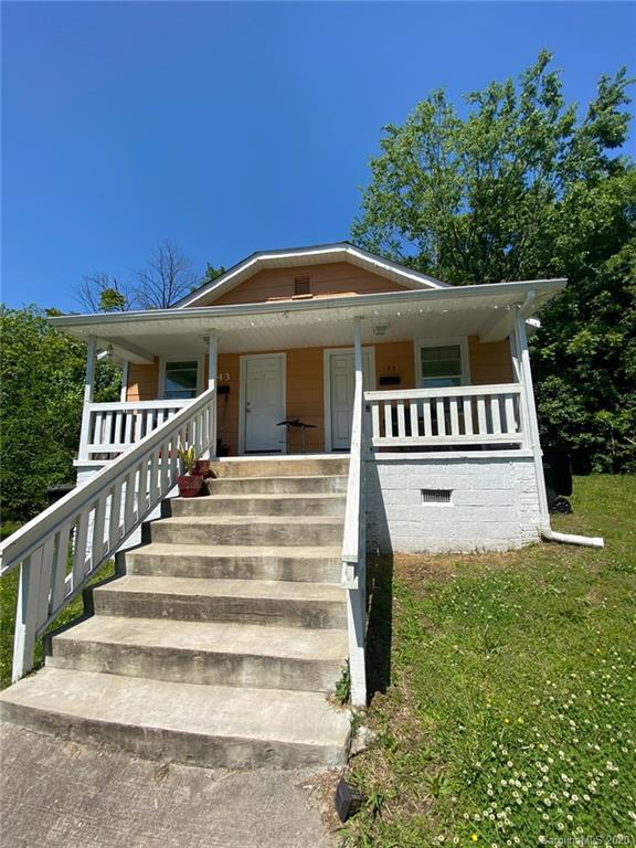 145 Lore Street Southwest Concord, NC 28025 - Photo 2 of 9 a view of a house with a yard