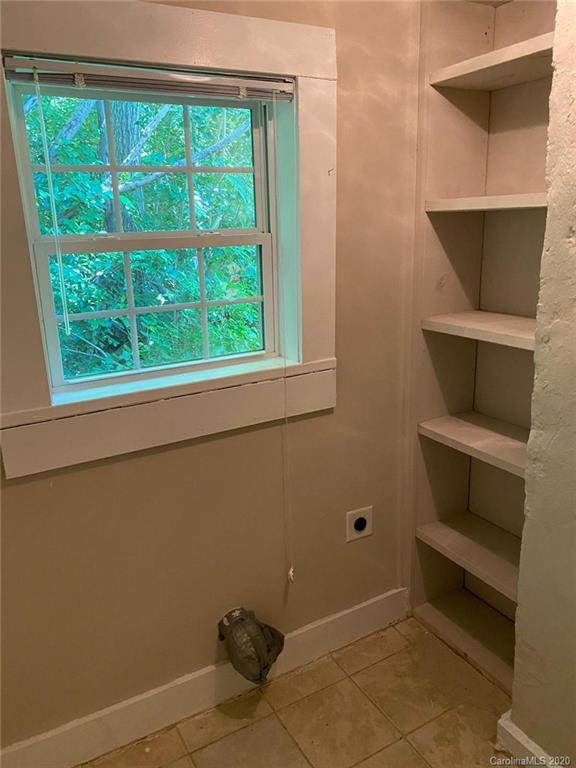 145 Lore Street Southwest Concord, NC 28025 - Photo 5 of 9 a room with storage and windows