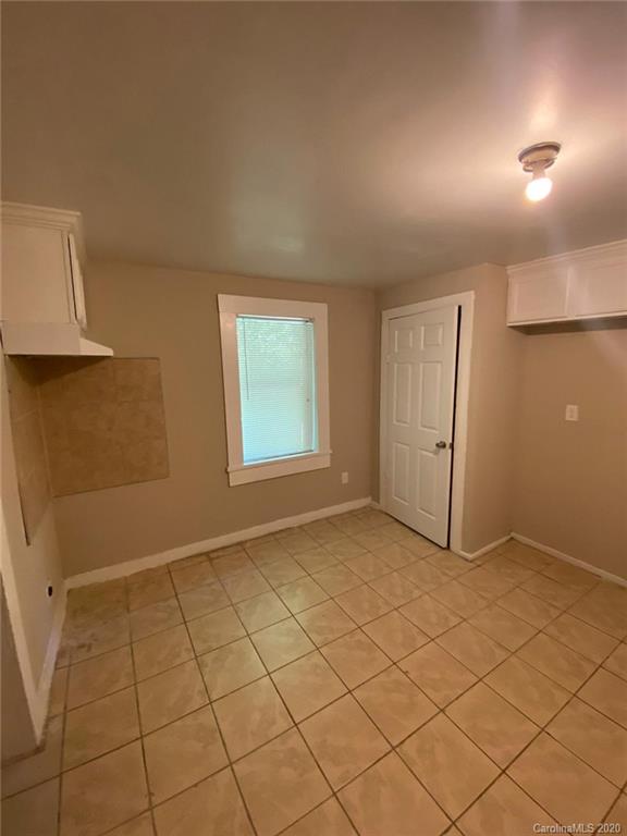 145 Lore Street Southwest Concord, NC 28025 - Photo 8 of 9 a view of an empty room and window