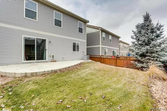 a view of a patio with a table and chairs