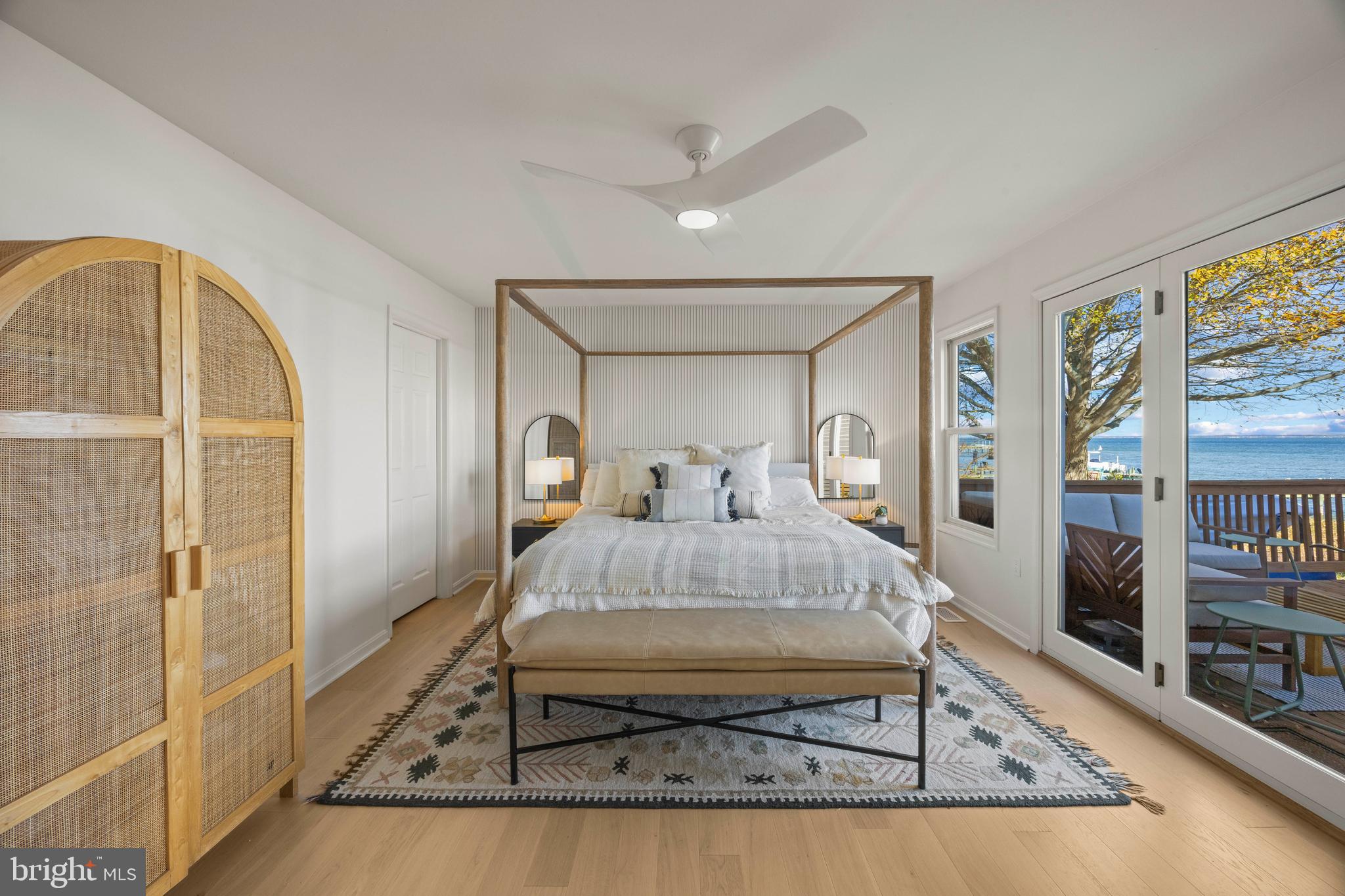 806 Monroe Manor Road Stevensville, MD 21619 - Photo 16 of 41 a living room with a bed and glass walk in closet