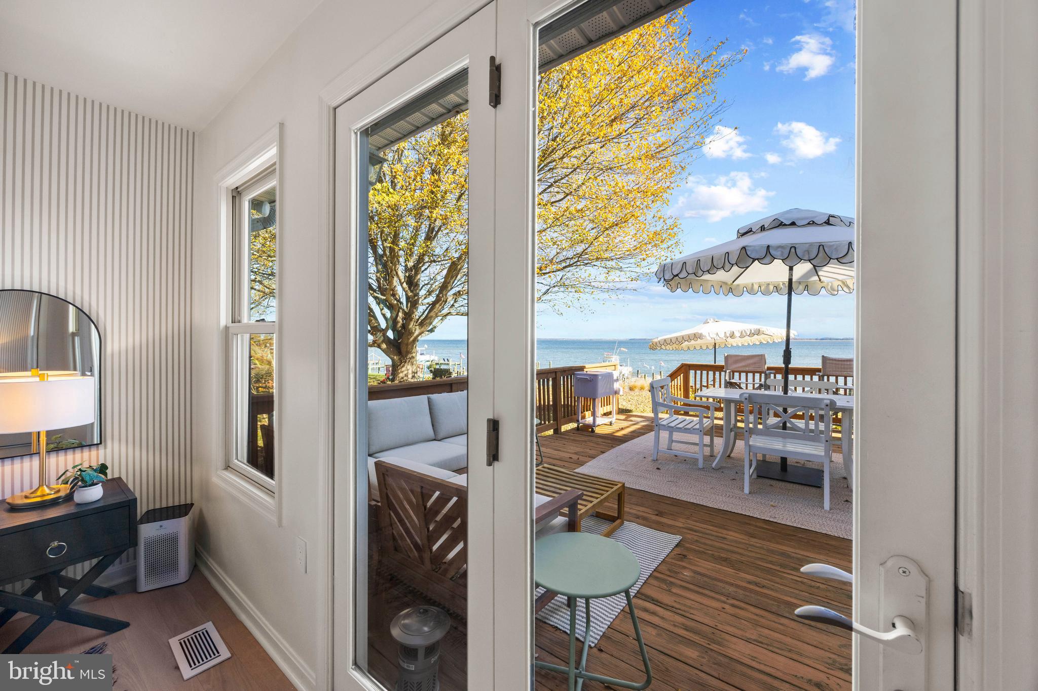 806 Monroe Manor Road Stevensville, MD 21619 - Photo 18 of 41 a living room with furniture and a floor to ceiling window