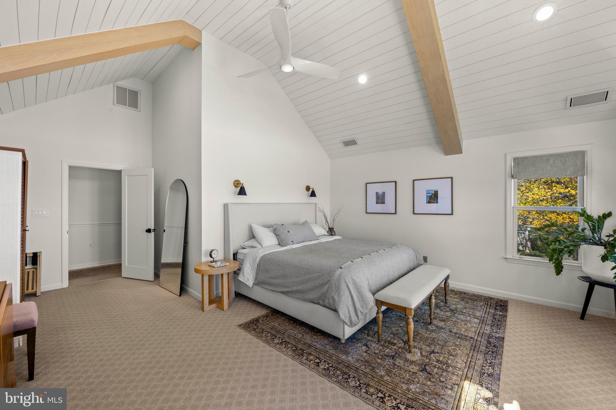 806 Monroe Manor Road Stevensville, MD 21619 - Photo 24 of 41 a spacious bedroom with a bed and a potted plant