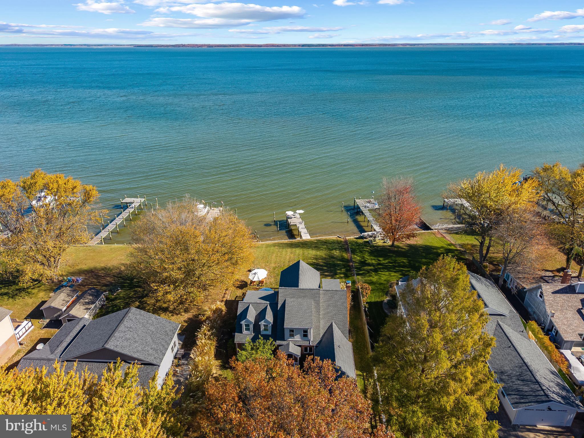 806 Monroe Manor Road Stevensville, MD 21619 - Photo 31 of 41 a view of a lake with a house in the background
