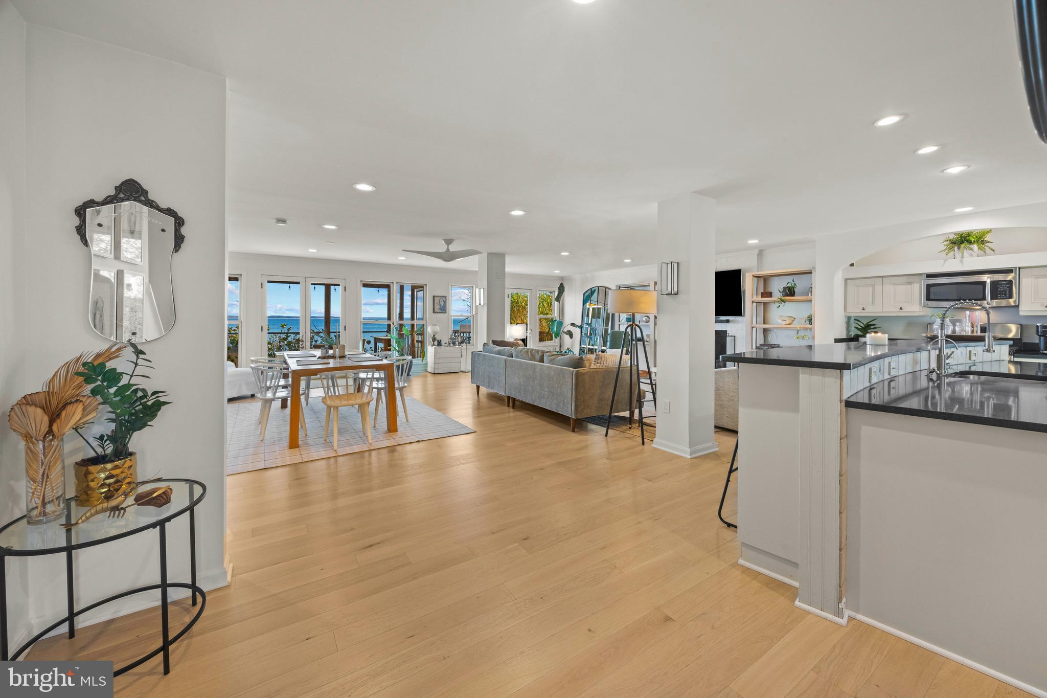 806 Monroe Manor Road Stevensville, MD 21619 - Photo 4 of 41 a living room with furniture a dining table and kitchen view