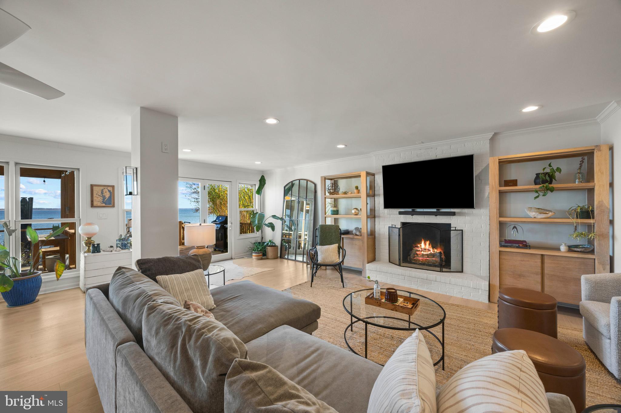 806 Monroe Manor Road Stevensville, MD 21619 - Photo 6 of 41 a living room with furniture and a fireplace