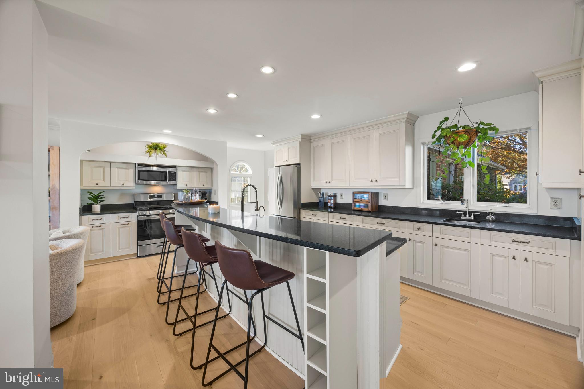 806 Monroe Manor Road Stevensville, MD 21619 - Photo 9 of 41 a kitchen with stainless steel appliances kitchen island granite countertop a sink and cabinets