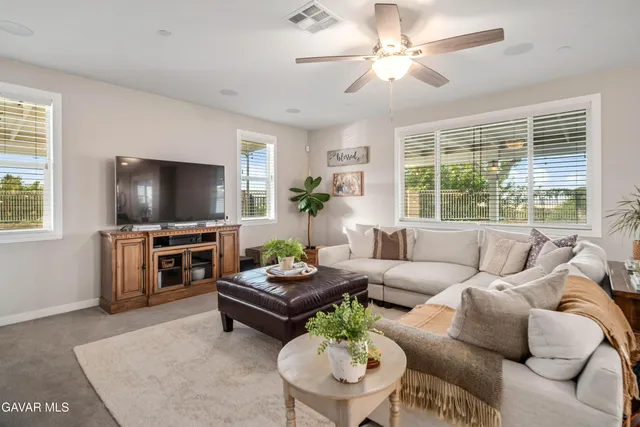 a kitchen with stainless steel appliances a sink stove and cabinets