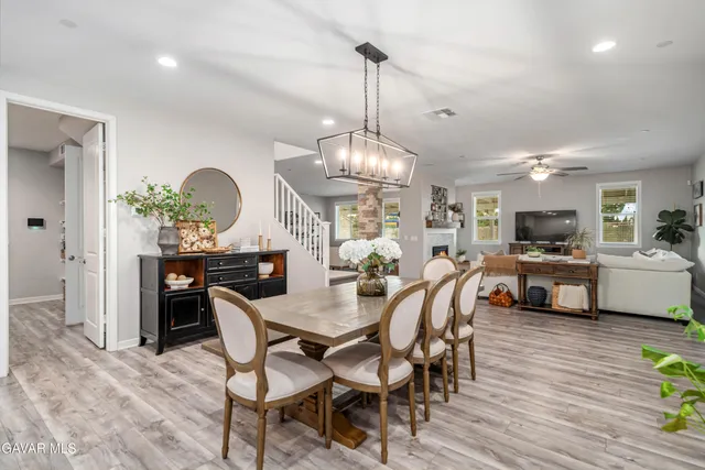 a bedroom with a bed and a potted plant
