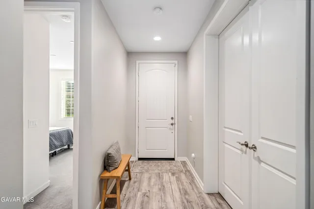 a spacious bathroom with a double vanity sink a mirror and a bathtub