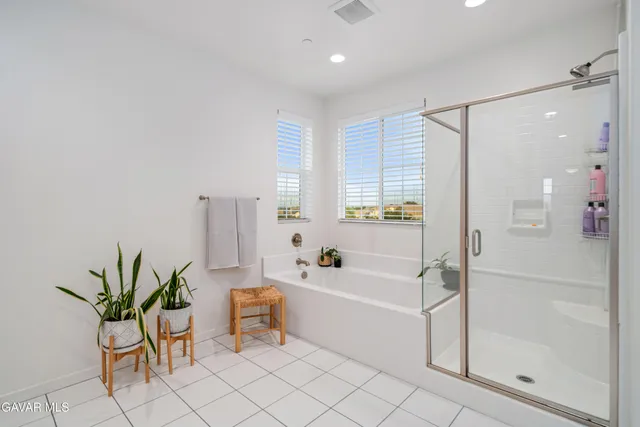 an aerial view of a houses with a city street