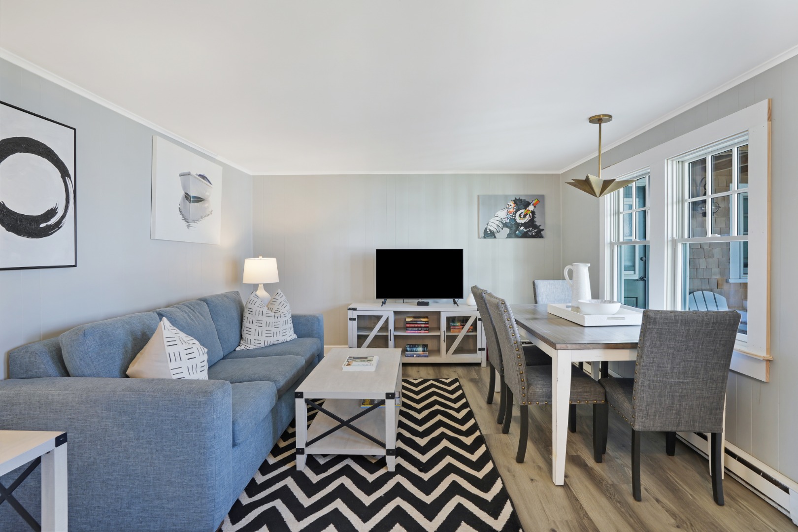 20 Peases Point Way North, Unit 4 Edgartown, MA 02539 - Photo 2 of 11 a living room with furniture a flat screen tv and a window