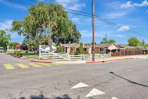 a view of a house with a street