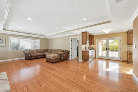 a living room with furniture window and wooden floor