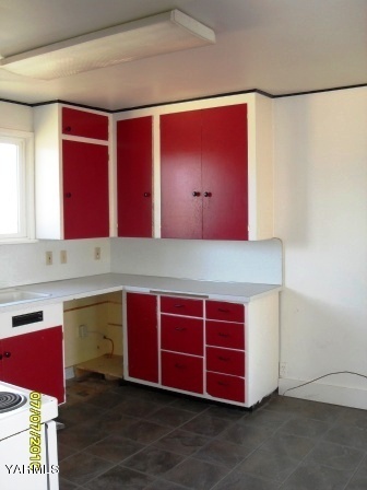 442 Hatton Road Tieton, WA 98947 - Photo 6 of 8 a room with stainless steel appliances wooden cabinets and a counter top