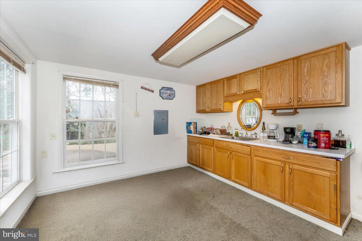 10891 Bethesda Church Road Damascus, MD 20872 - Photo 11 of 51 a kitchen with sink cabinets and window