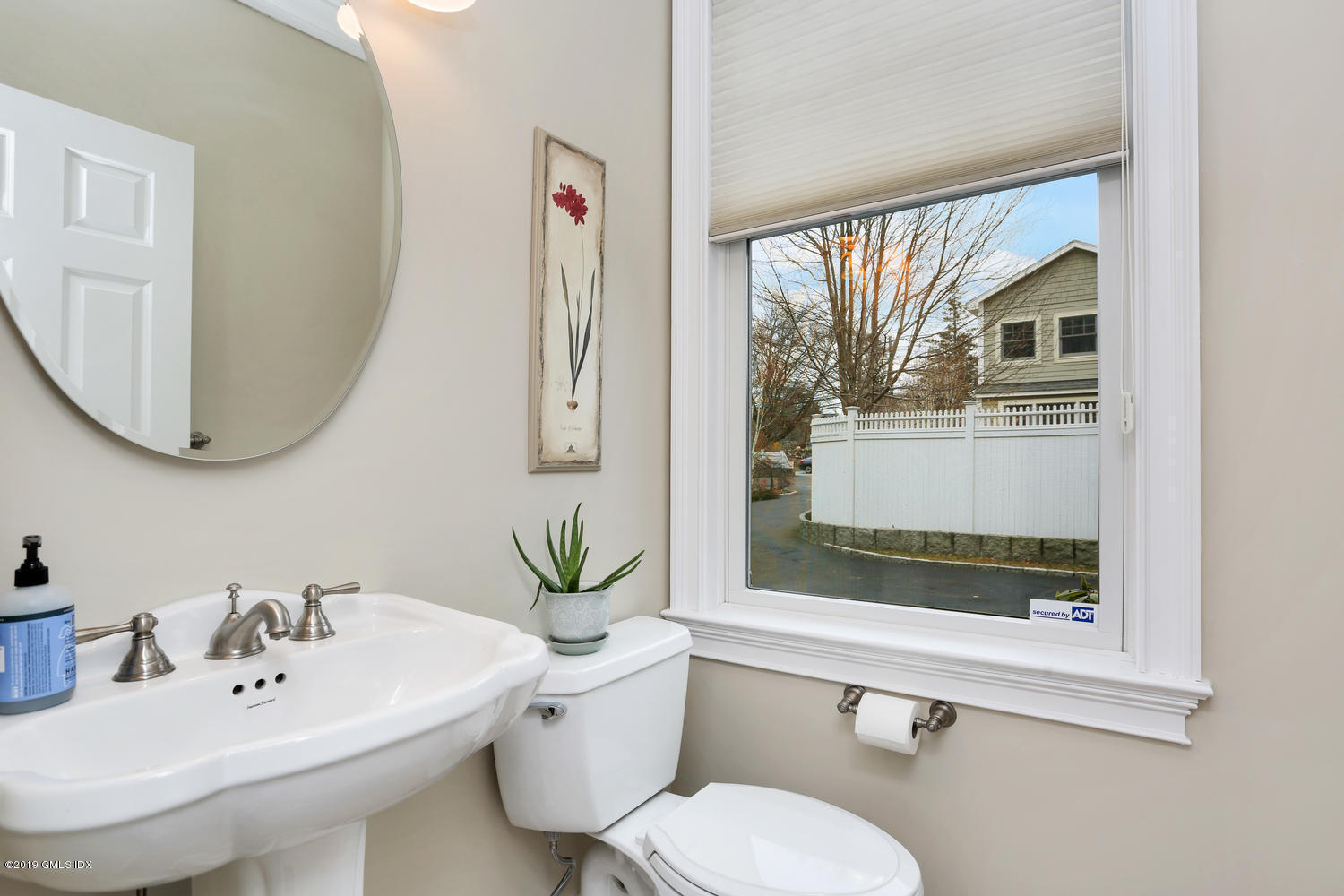 54 Valley Road, Unit A Cos Cob, CT 06807 - Photo 12 of 32 a bathroom with a sink and a mirror