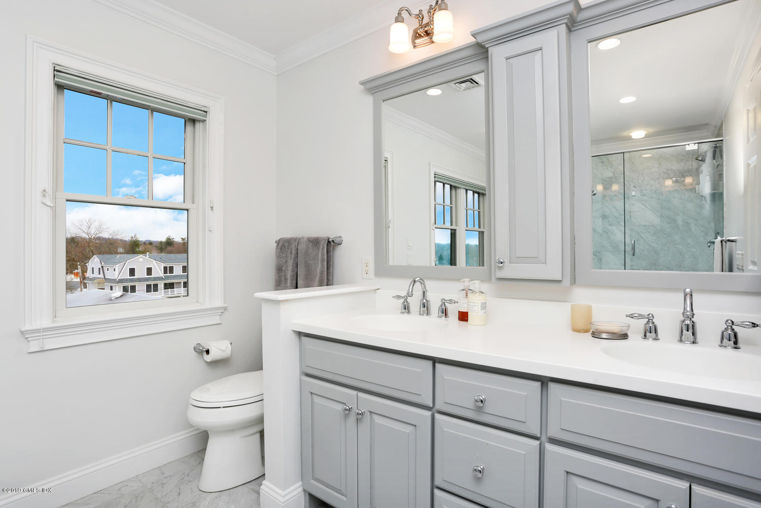 54 Valley Road, Unit A Cos Cob, CT 06807 - Photo 17 of 32 a bathroom with a toilet sink and mirror