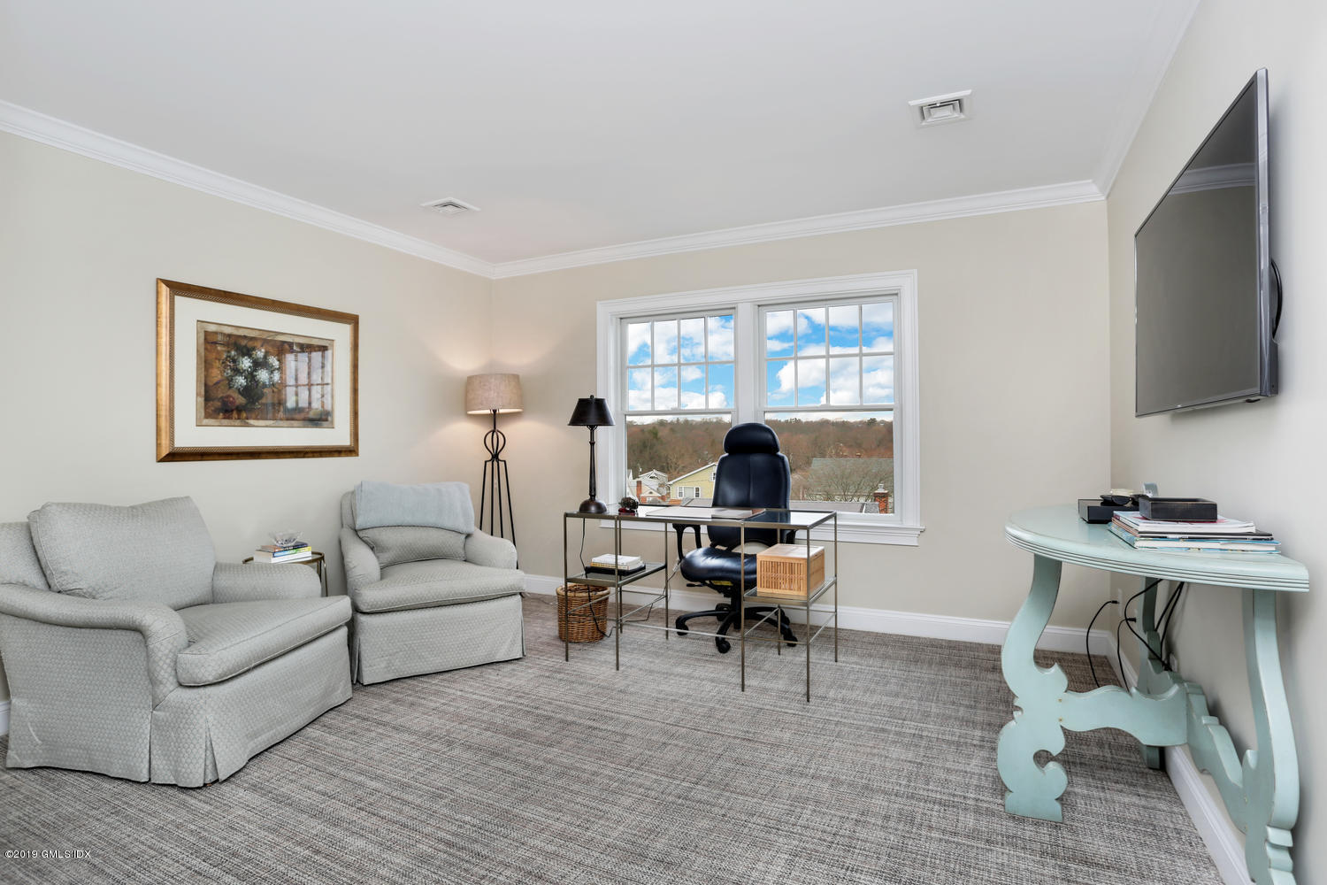 54 Valley Road, Unit A Cos Cob, CT 06807 - Photo 19 of 32 a living room with furniture a flat screen tv and a window