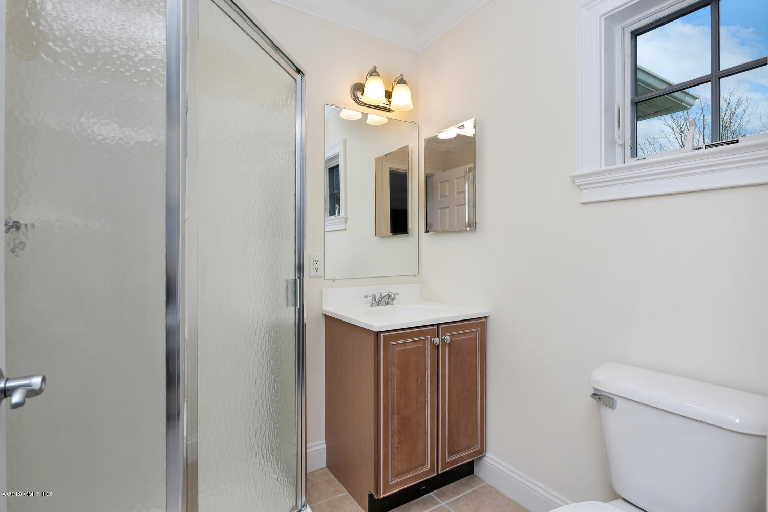 54 Valley Road, Unit A Cos Cob, CT 06807 - Photo 22 of 32 a bathroom with a toilet a sink and mirror