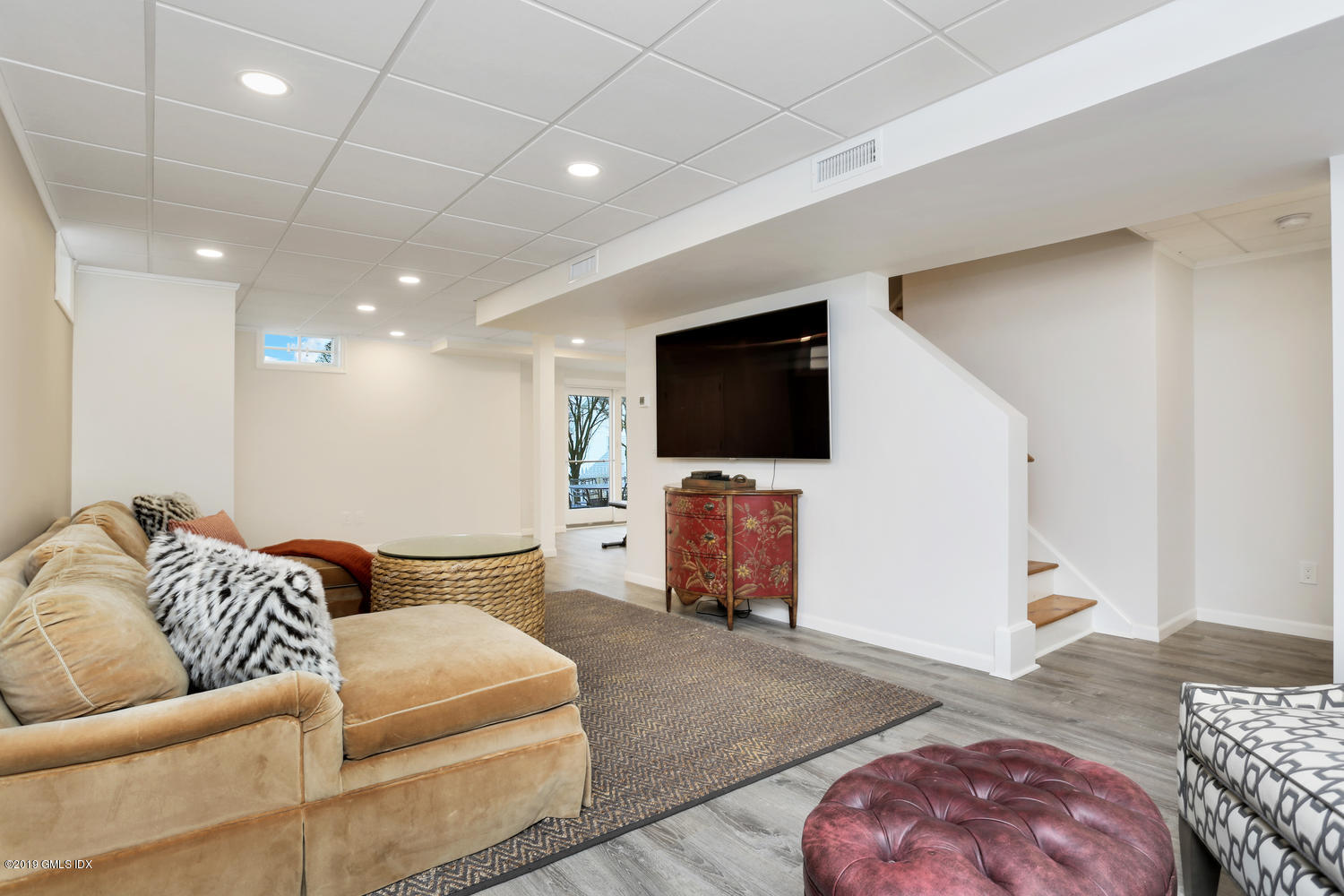 54 Valley Road, Unit A Cos Cob, CT 06807 - Photo 23 of 32 a living room with furniture and a flat screen tv