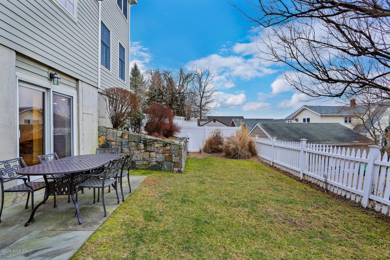 54 Valley Road, Unit A Cos Cob, CT 06807 - Photo 28 of 32 a view of a backyard with furniture