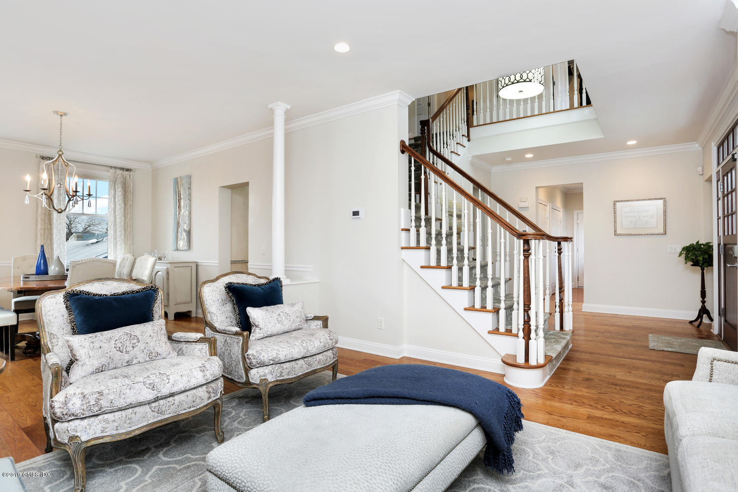 54 Valley Road, Unit A Cos Cob, CT 06807 - Photo 5 of 32 a bedroom with furniture and a chandelier