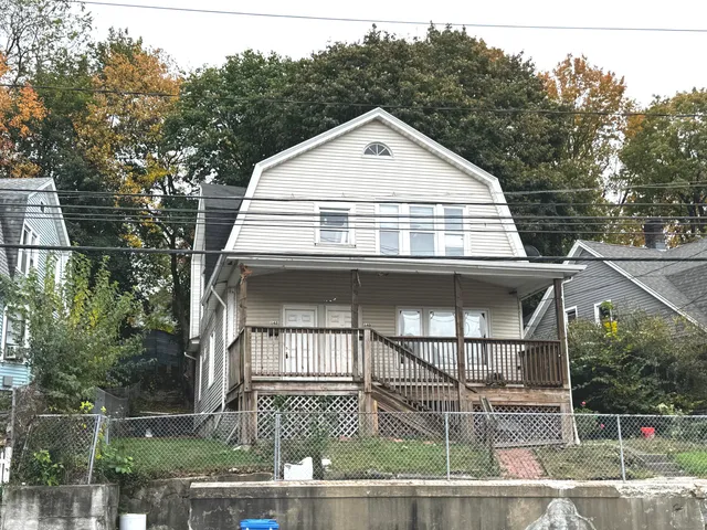 a view of front of house with a yard