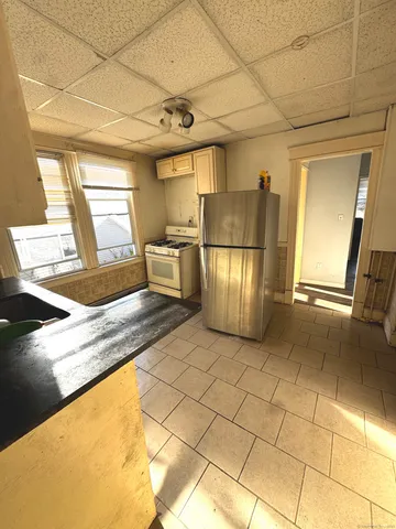 a view of a kitchen with furniture and a kitchen