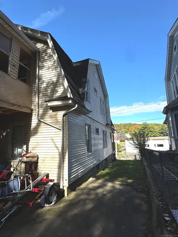 a view of a house with a street