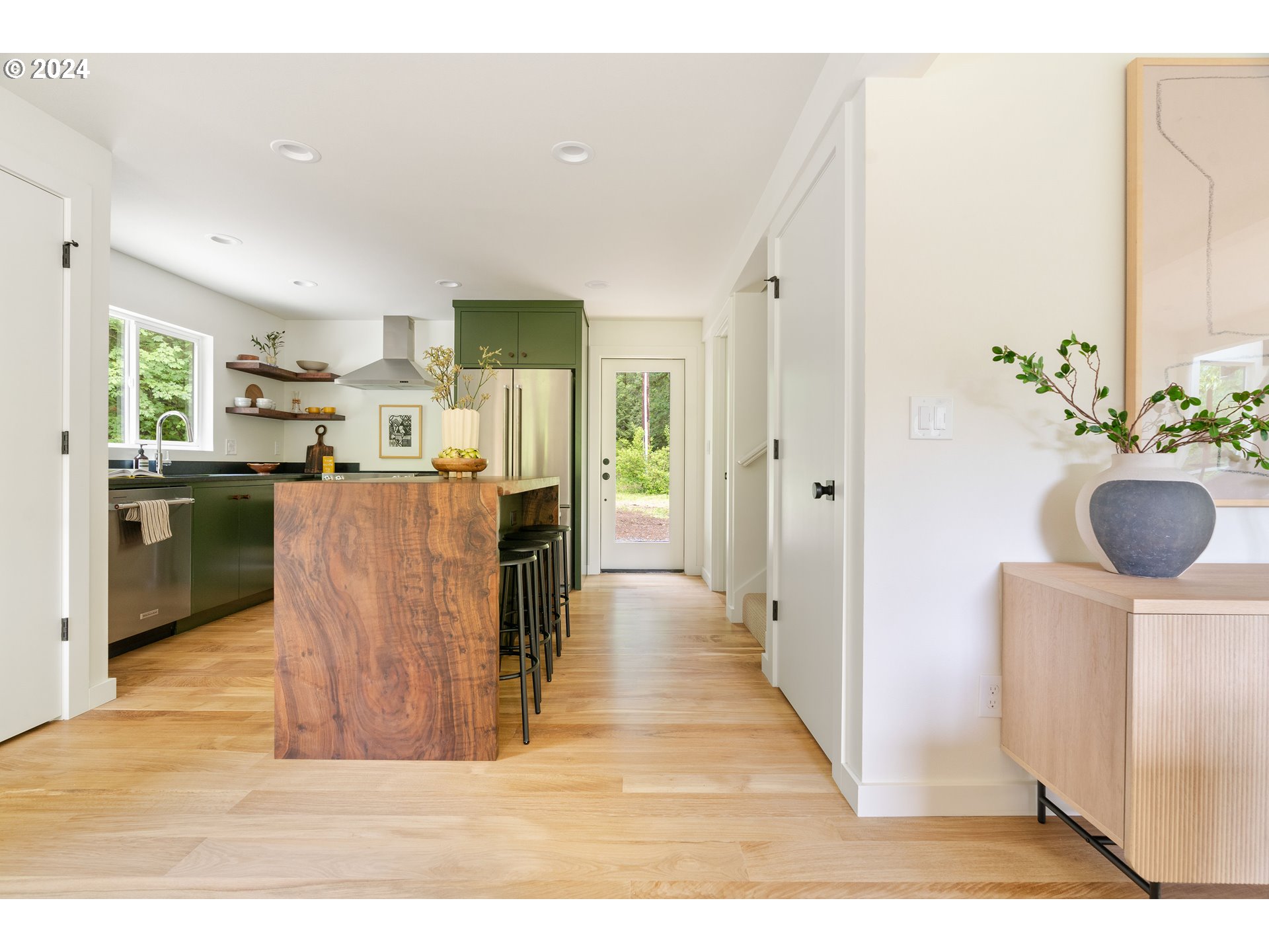 2162 Duncan Creek Road Stevenson, WA 98648 - Photo 13 of 38 a kitchen with stainless steel appliances kitchen island granite countertop a refrigerator and a sink