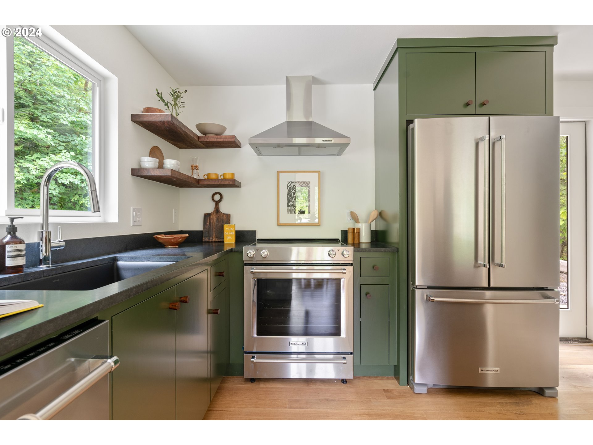 2162 Duncan Creek Road Stevenson, WA 98648 - Photo 16 of 38 a kitchen with stainless steel appliances a stove a refrigerator and a sink